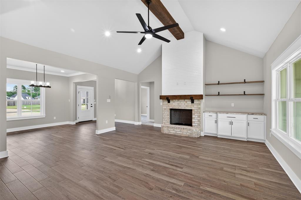 127 Sitka Loop Haughton, LA 71037 - Photo 5 of 29 a view of a kitchen with furniture and a fireplace