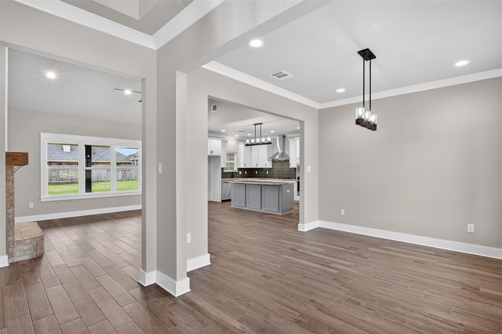 127 Sitka Loop Haughton, LA 71037 - Photo 7 of 29 a view of a kitchen with wooden floor