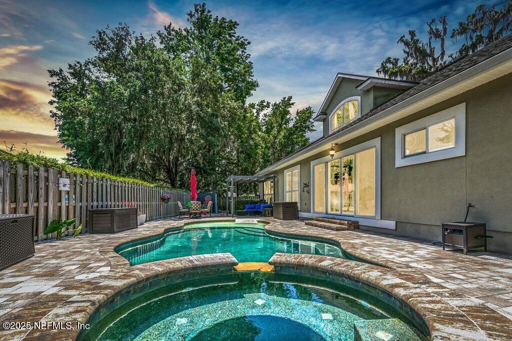 2918 Grande Oaks Way Fleming Island, FL 32003 - Photo 24 of 54 a view of a house with backyard and sitting area