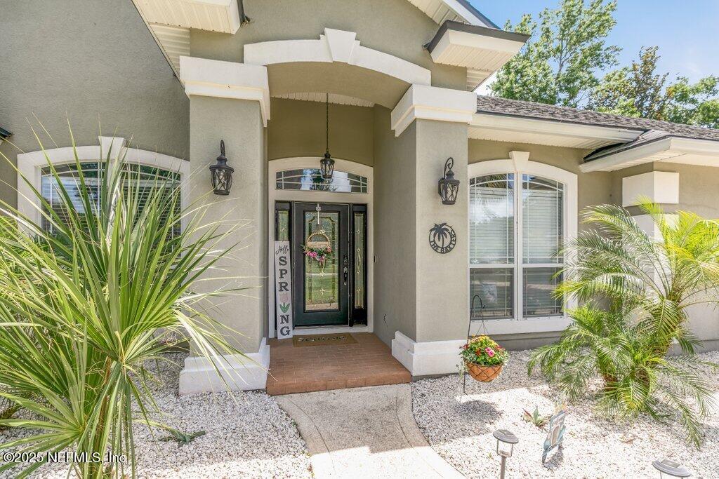 2918 Grande Oaks Way Fleming Island, FL 32003 - Photo 4 of 54 a view of a entryway door front of house