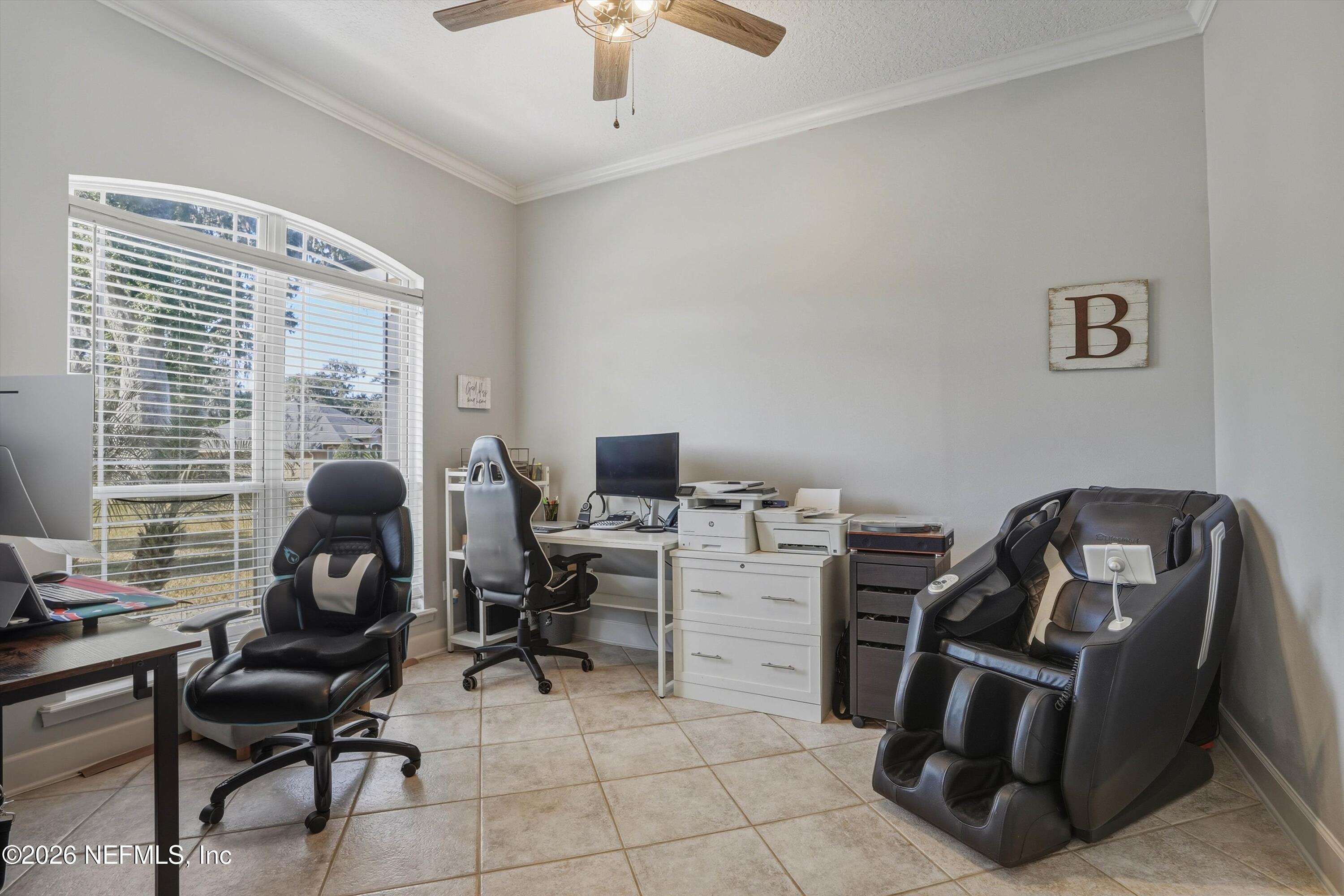 2918 Grande Oaks Way Fleming Island, FL 32003 - Photo 7 of 54 a view of a workspace with furniture and a window