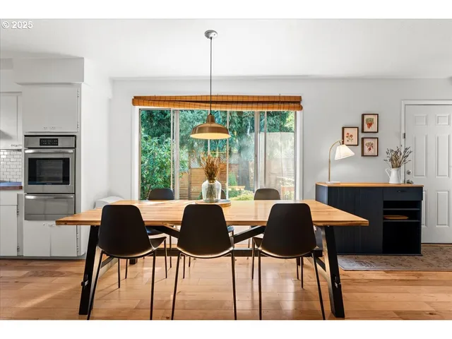 a dining room with furniture and window