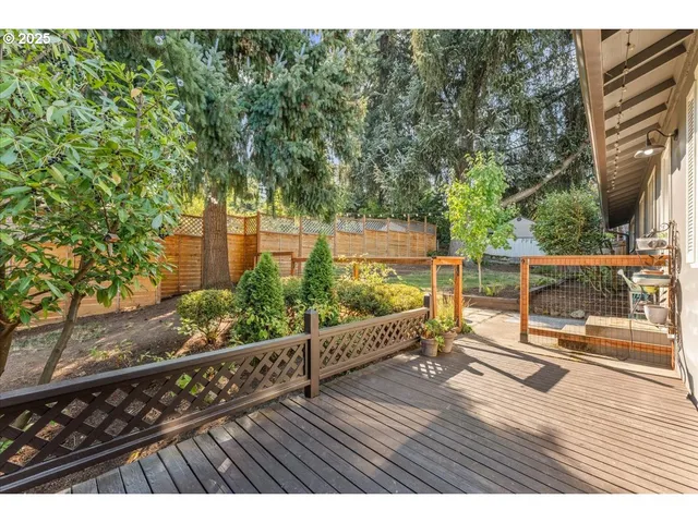 a backyard of a house with a yard and outdoor seating
