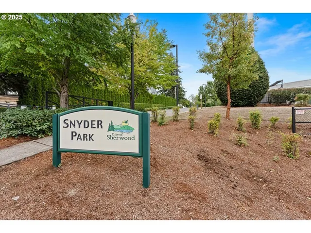 a view of a backyard with sitting area