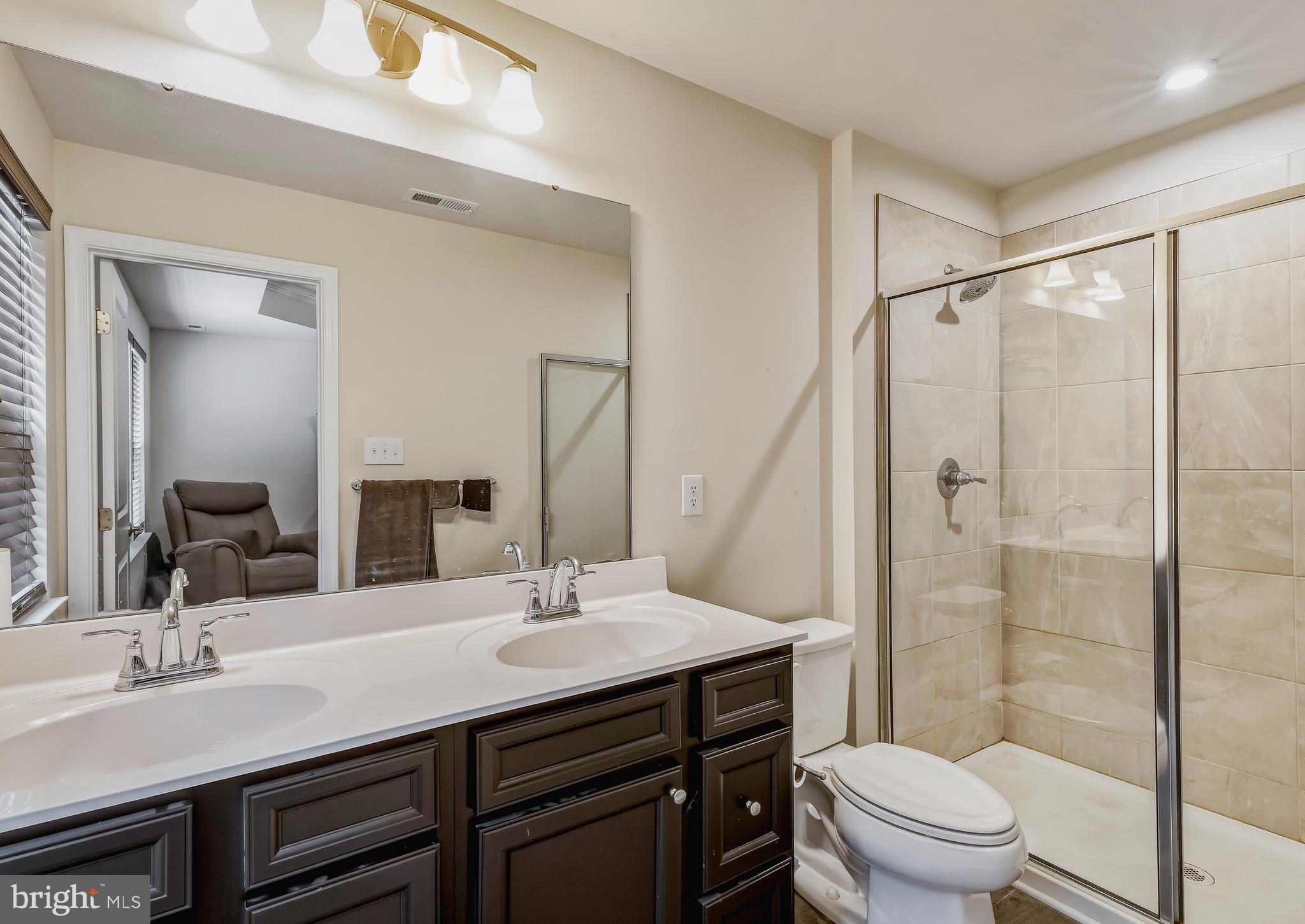 36 Continental Boulevard Sicklerville, NJ 08081 - Photo 24 of 25 a bathroom with a double vanity sink toilet and shower