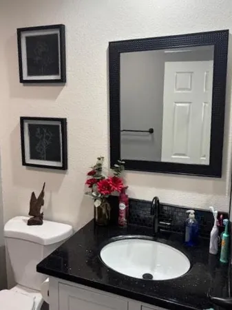 a bathroom with a sink and a mirror