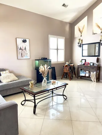 a living room with furniture and a window