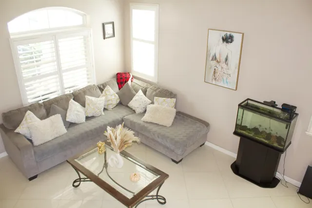 a living room with furniture and a window