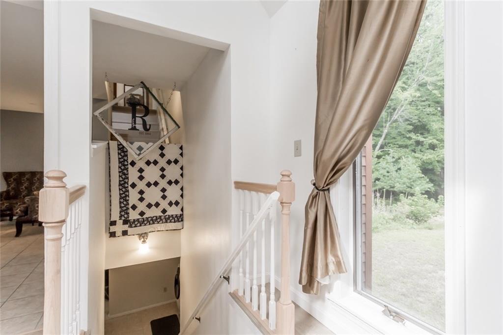 468 Bridgton Road Westbrook, ME 04092 - Photo 20 of 33 The unique stairway is split, with...