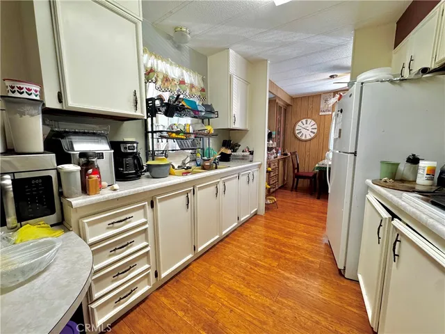 a kitchen with stainless steel appliances granite countertop a sink and cabinets