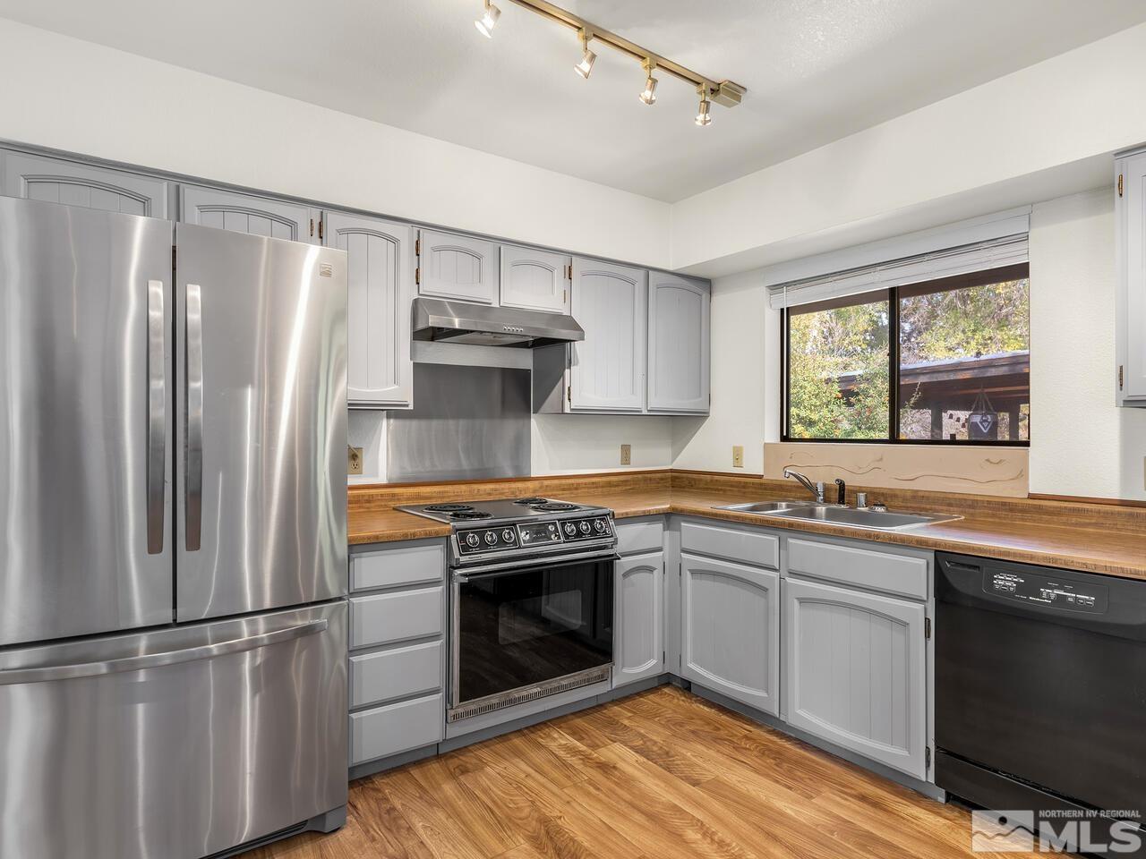 665 College Drive Reno, NV 89503 - Photo 13 of 25 a kitchen with a stove sink and refrigerator