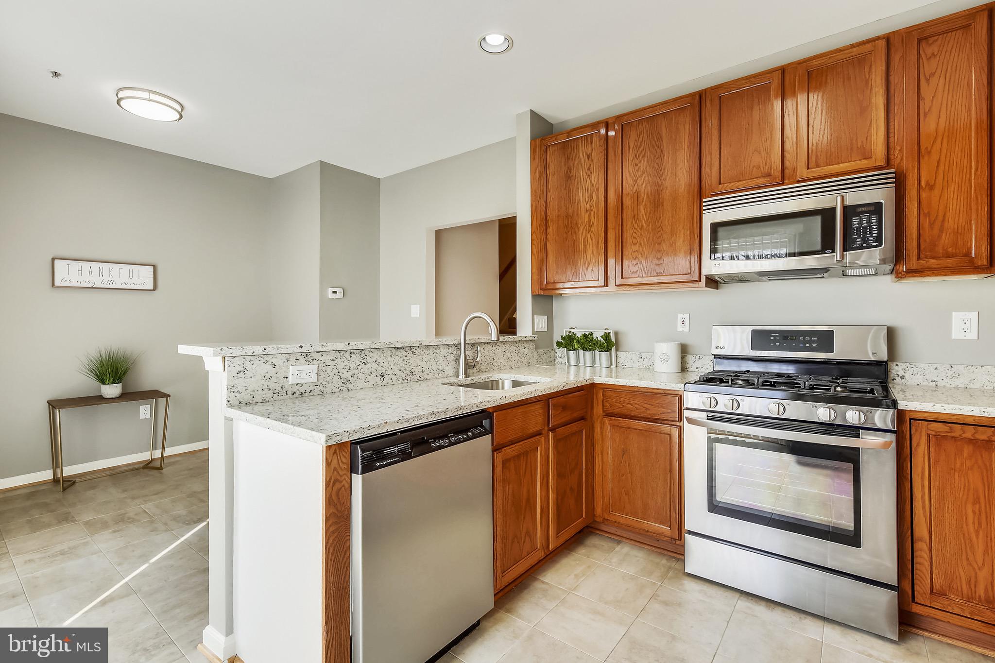12157 Amber Ridge Circle Germantown, MD 20876 - Photo 12 of 36 Kitchen open to Dining area