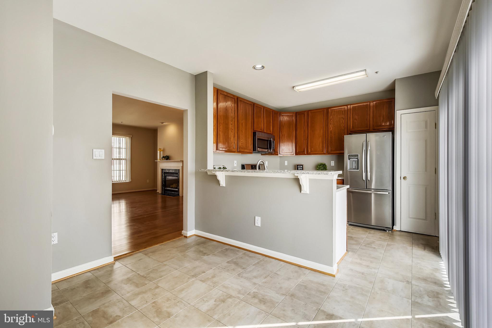 12157 Amber Ridge Circle Germantown, MD 20876 - Photo 14 of 36 Breakfast Bar with Granite countertop