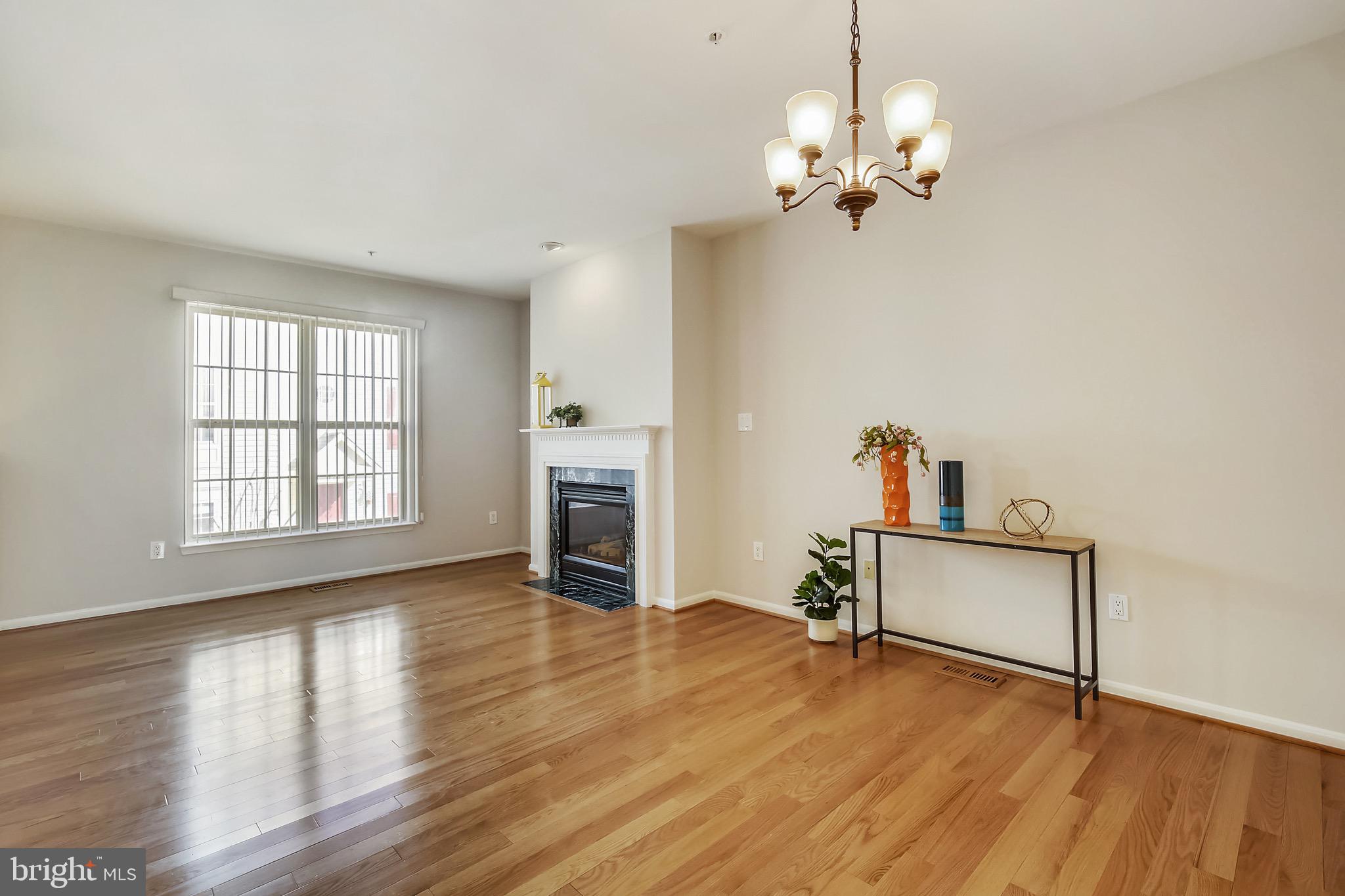12157 Amber Ridge Circle Germantown, MD 20876 - Photo 16 of 36 Formal Dining Room & Family Room Combo w/Hardwood