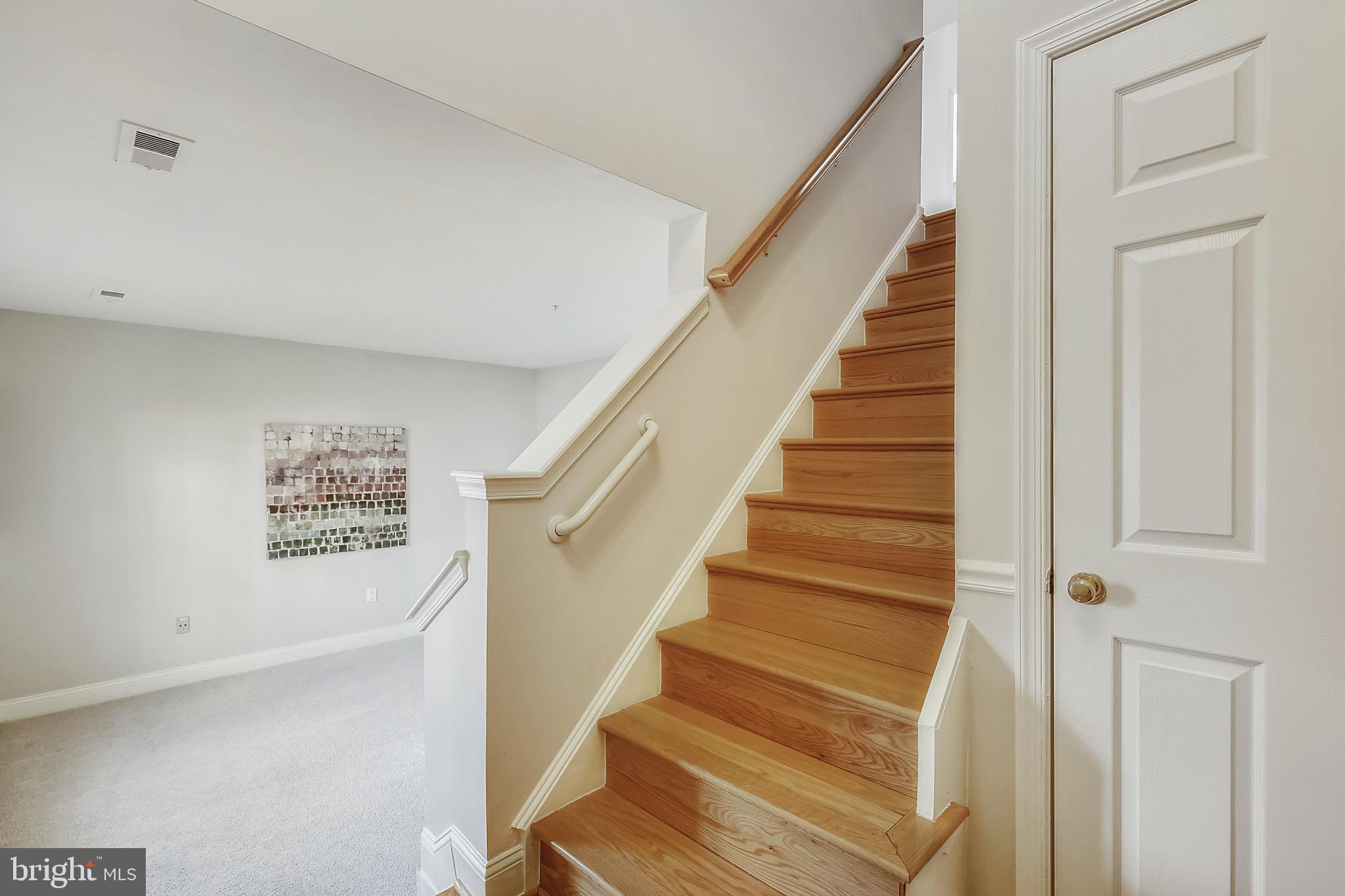 12157 Amber Ridge Circle Germantown, MD 20876 - Photo 10 of 36 Staircase to main level and coat closet at foyer