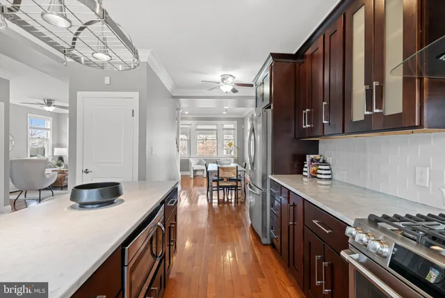 a kitchen with sink cabinets and stove