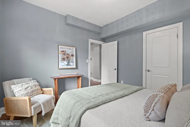 a bedroom with a bed and a couch