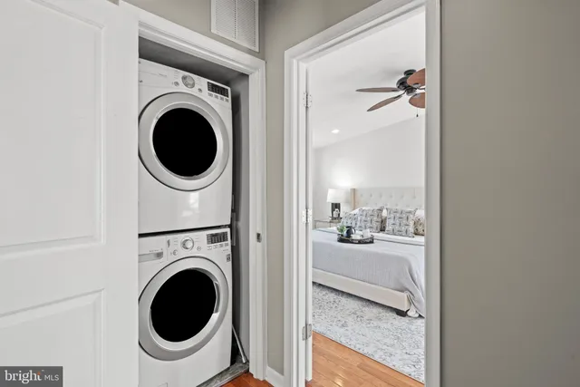 a view of a hallway with washer and dryer
