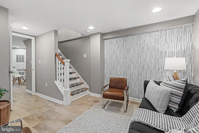 a view of a bedroom with furniture and wooden floor