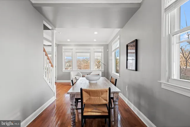 a dining room with furniture and window