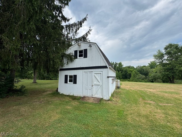 620 Ravenna Road Newton Falls, OH 44444 - Photo 20 of 23 Two-story white barn structure featuring a gambrel roofline and dark accent shutters