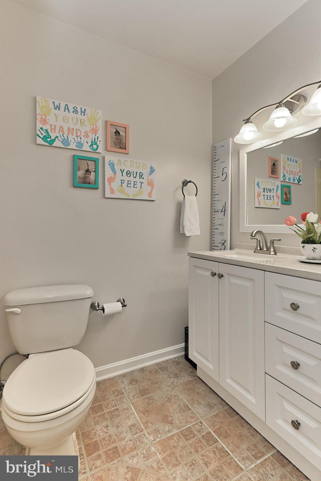 2404 Wanda Way Reston, VA 20191 - Photo 22 of 34 Hall Bath w Tile Flooring+ New Vanity + Lights