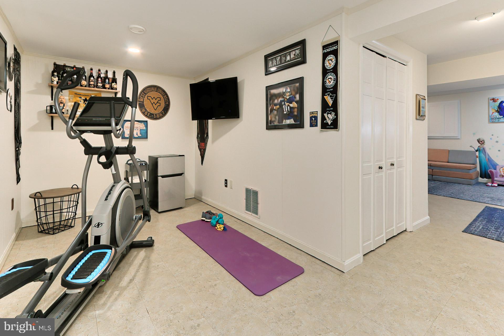 2404 Wanda Way Reston, VA 20191 - Photo 24 of 34 LL Home Gym Area w Vinyl Tile Flooring