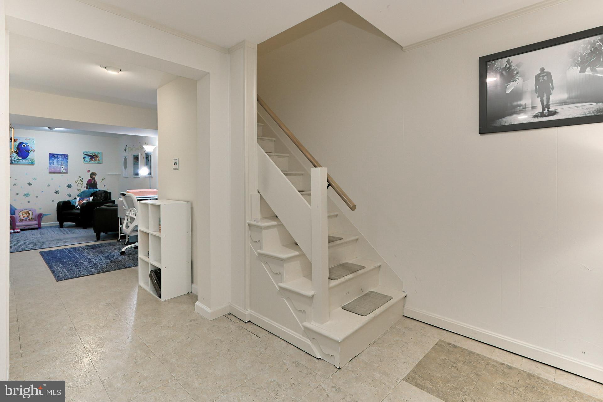 2404 Wanda Way Reston, VA 20191 - Photo 26 of 34 Hallway Features a Closet + Stairs to Family Room