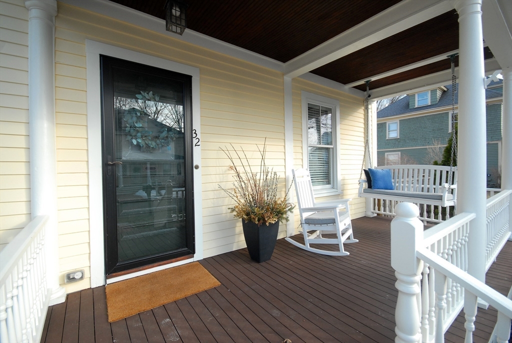 32 Highland Street Concord, MA 01742 - Photo 14 of 28 a view of a house with porch and wooden floor