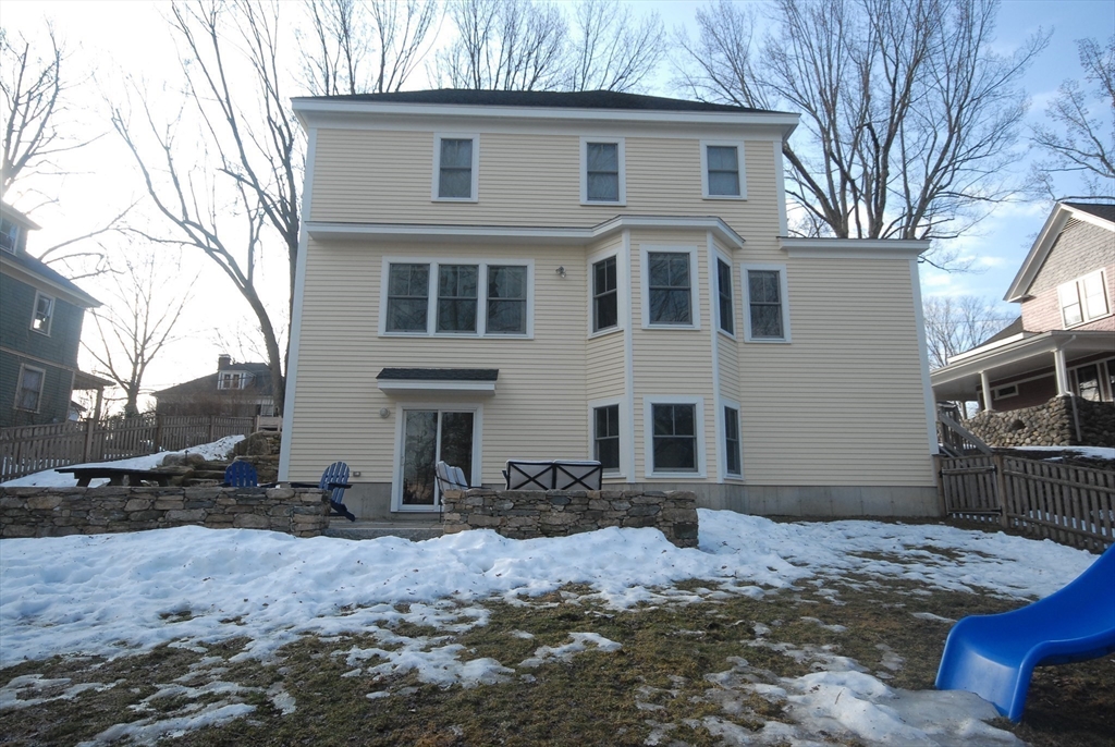32 Highland Street Concord, MA 01742 - Photo 16 of 28 a front view of a house with a yard