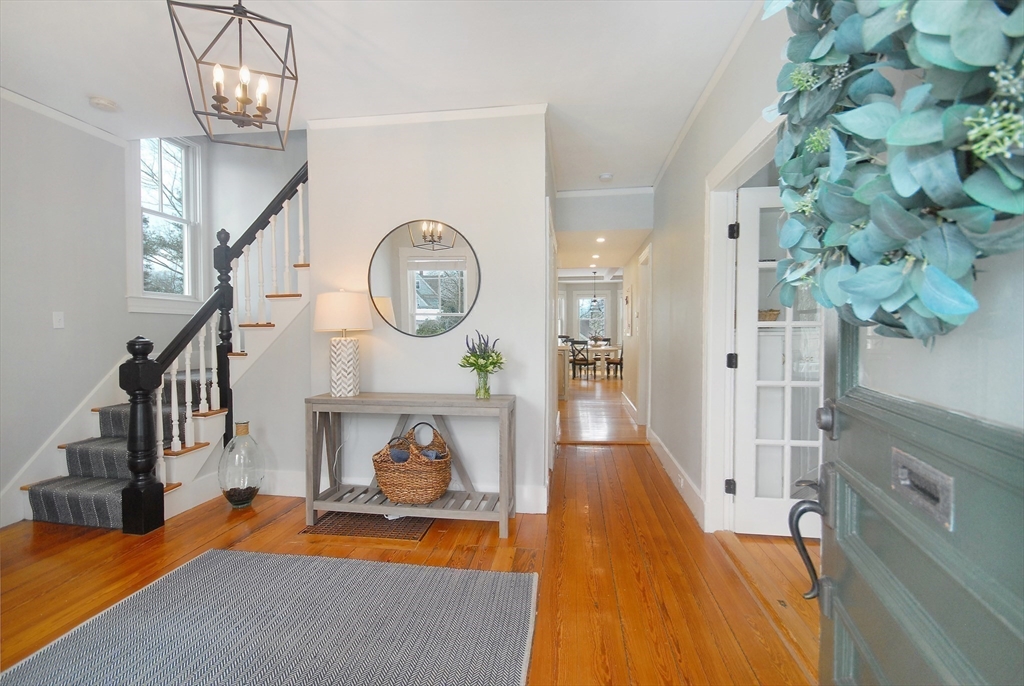 32 Highland Street Concord, MA 01742 - Photo 24 of 28 a view of a hallway to a livingroom with furniture a fire place