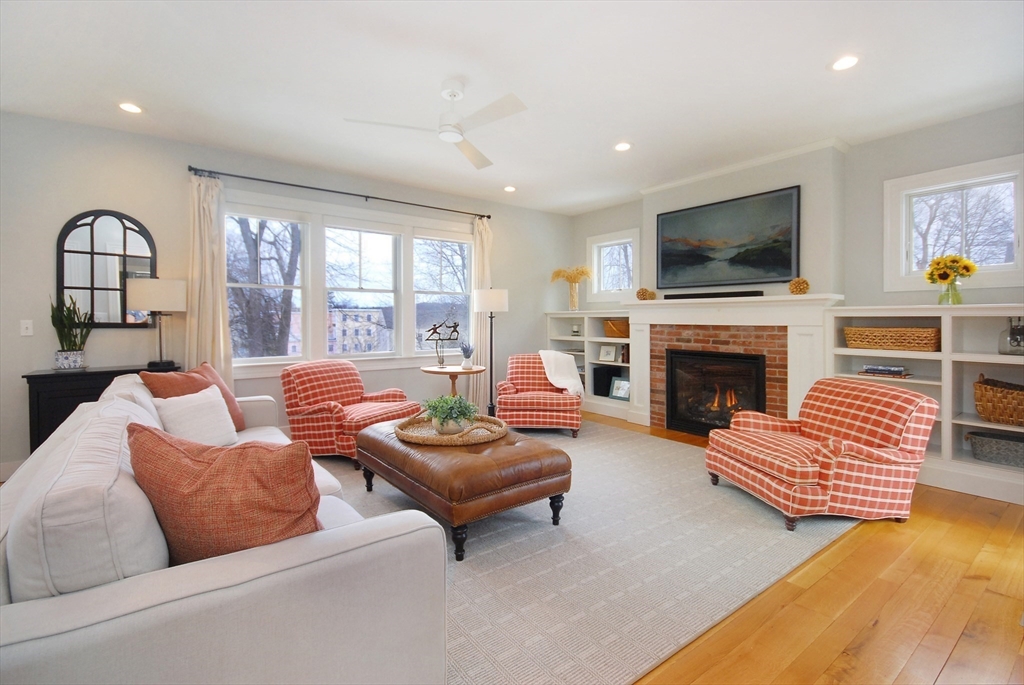 32 Highland Street Concord, MA 01742 - Photo 3 of 28 a living room with furniture fireplace and a flat screen tv