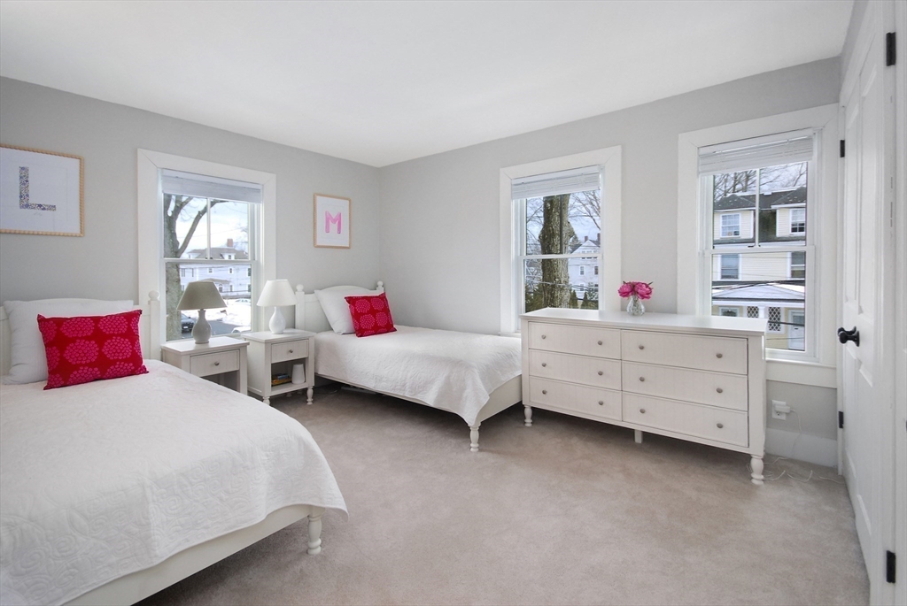 32 Highland Street Concord, MA 01742 - Photo 10 of 28 a bedroom with two beds and window