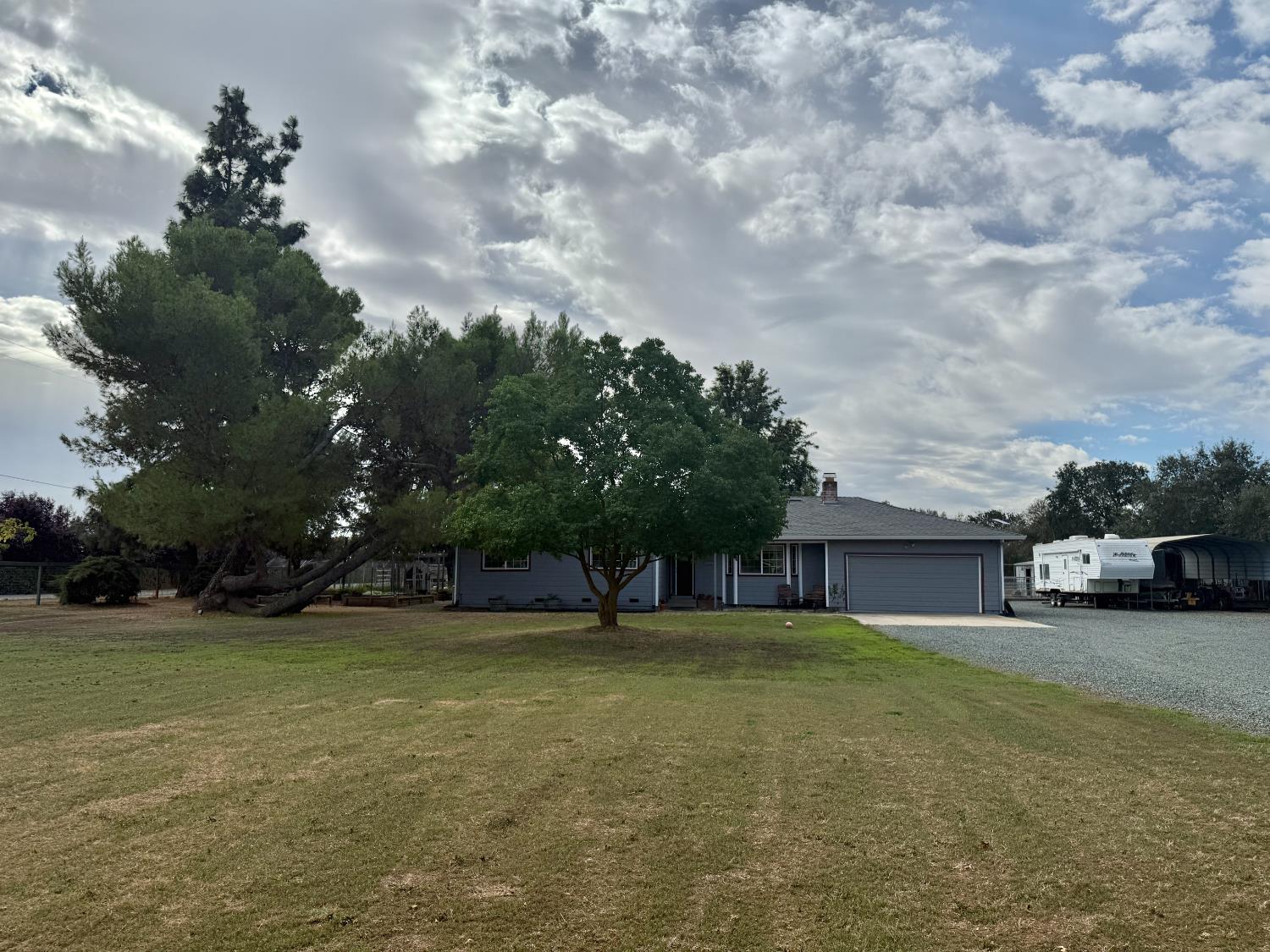 a view of swimming pool is middle in the middle of a yard