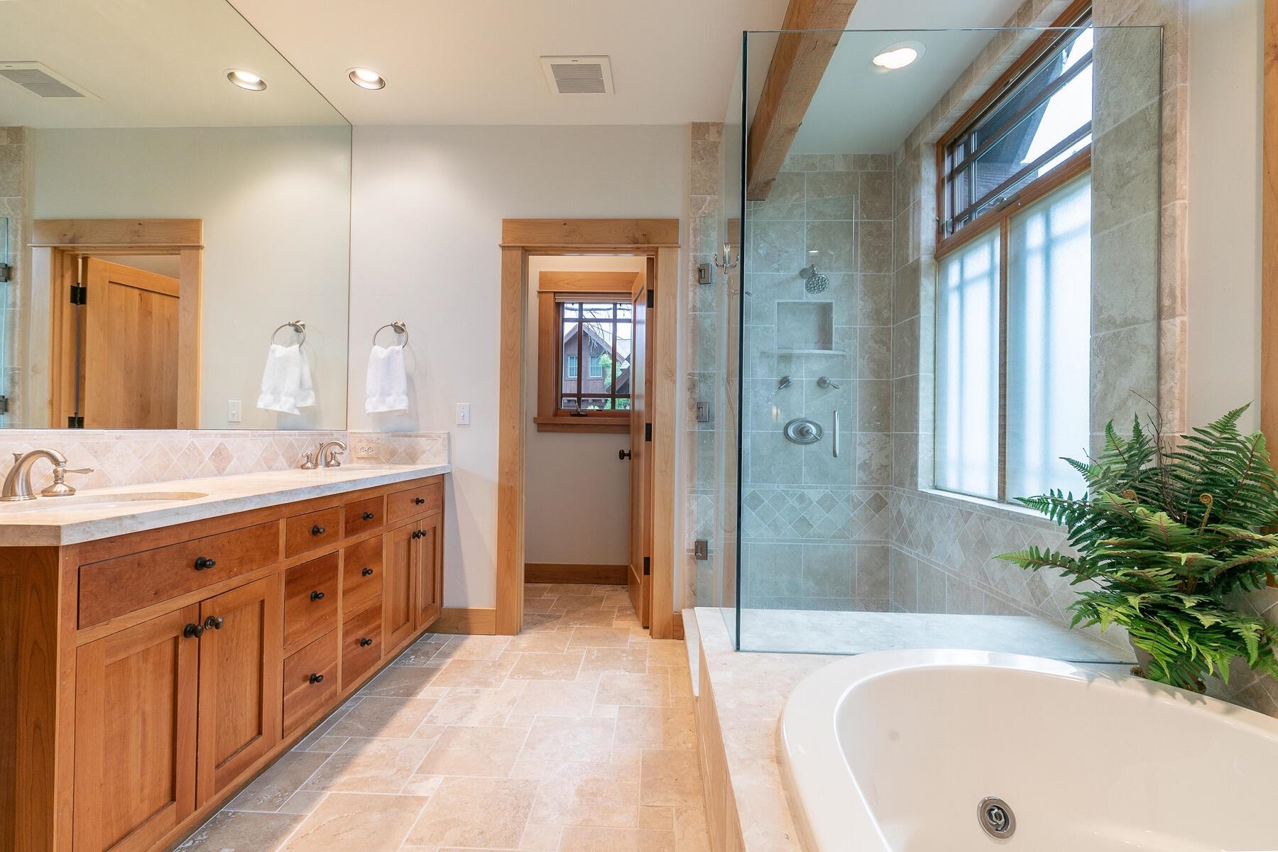 8433 Jake Teeter Drive Truckee, CA 96161 - Photo 15 of 21 a spacious bathroom with a tub sink shower and mirror