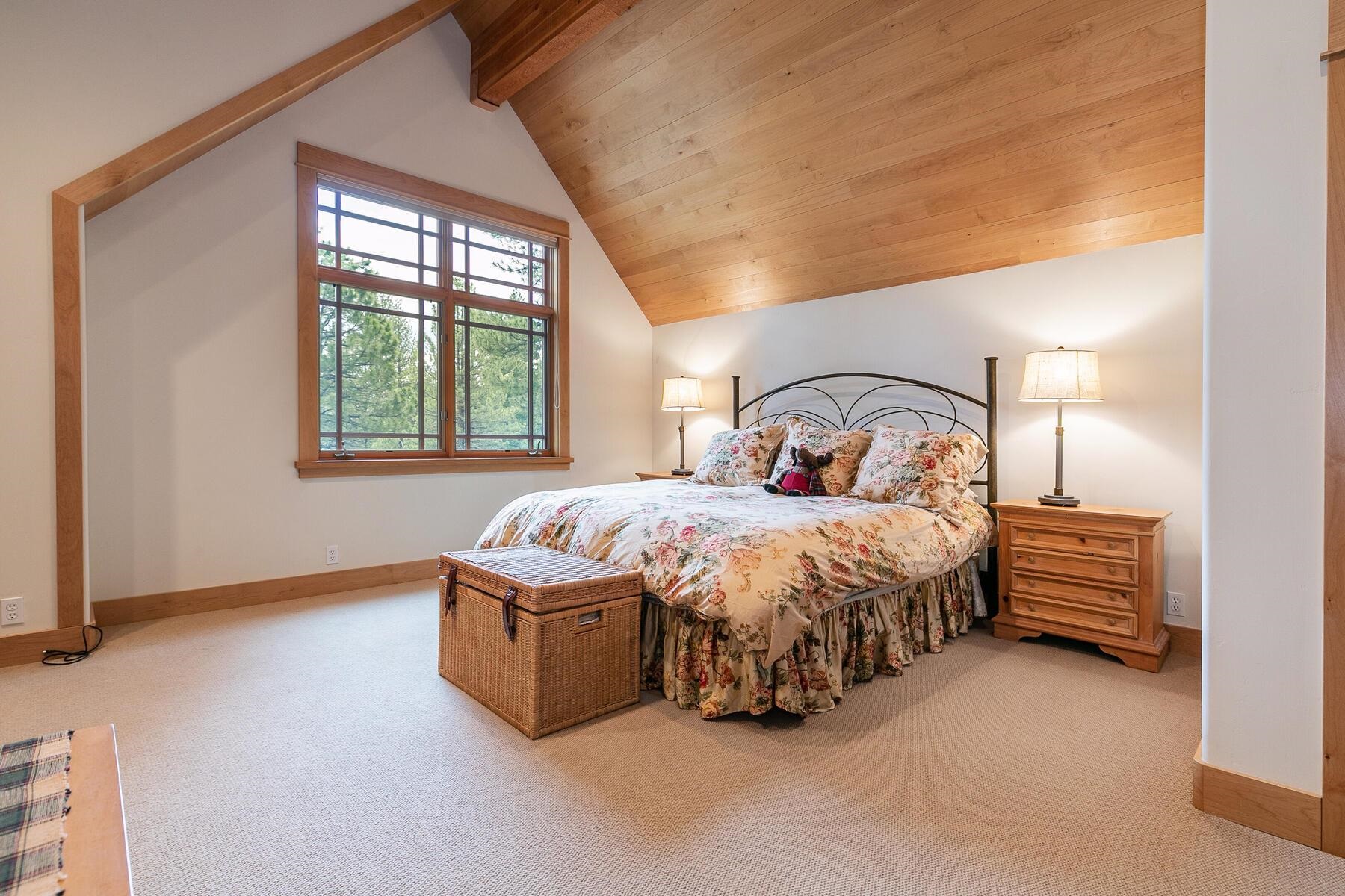 8433 Jake Teeter Drive Truckee, CA 96161 - Photo 20 of 21 a bedroom with a bed and a window