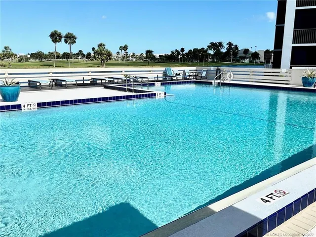 a view of a swimming pool with a terrace