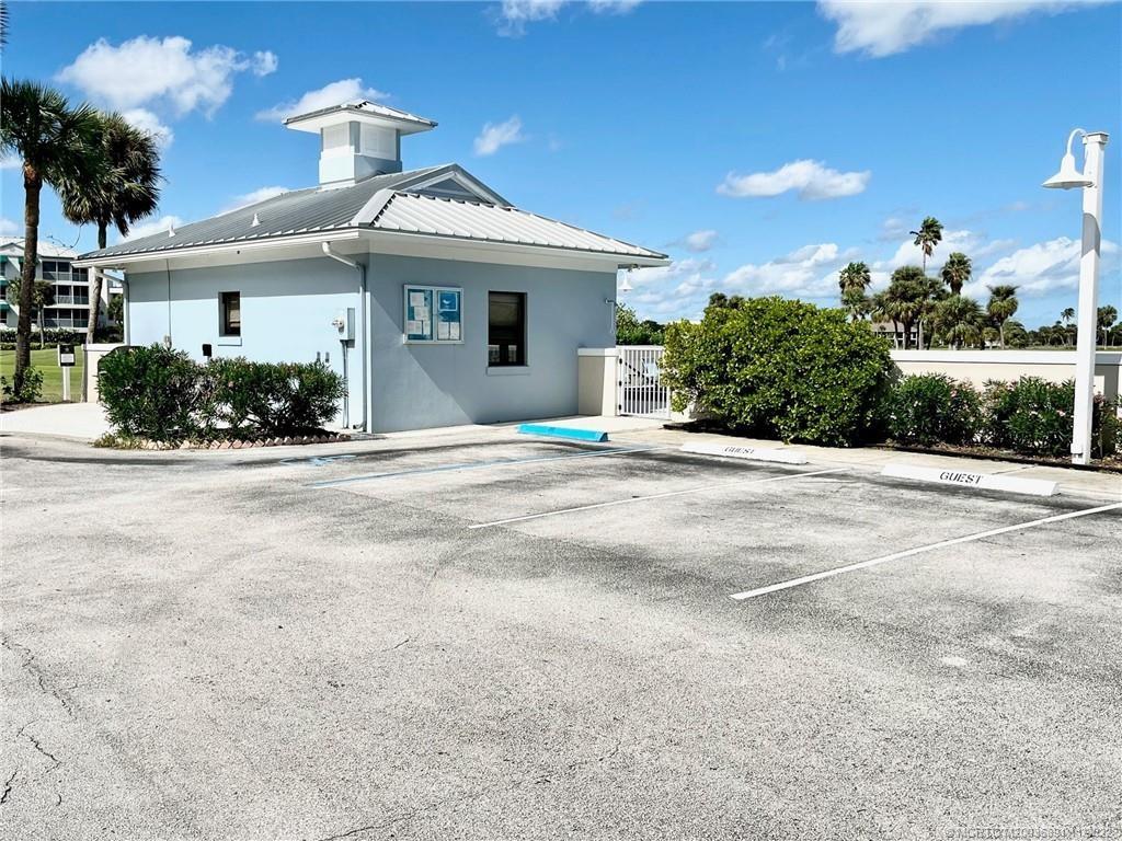 40 Northeast Plantation Road, Unit 208 Stuart, FL 34996 - Photo 15 of 38 front view of a house with a outdoor space