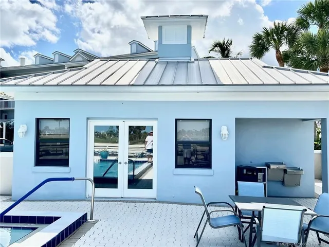 a view of swimming pool with outdoor seating
