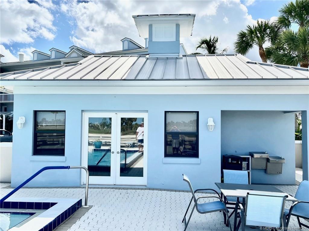 40 Northeast Plantation Road, Unit 208 Stuart, FL 34996 - Photo 16 of 38 a view of a house with a patio