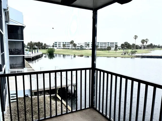 a view of lake with green space