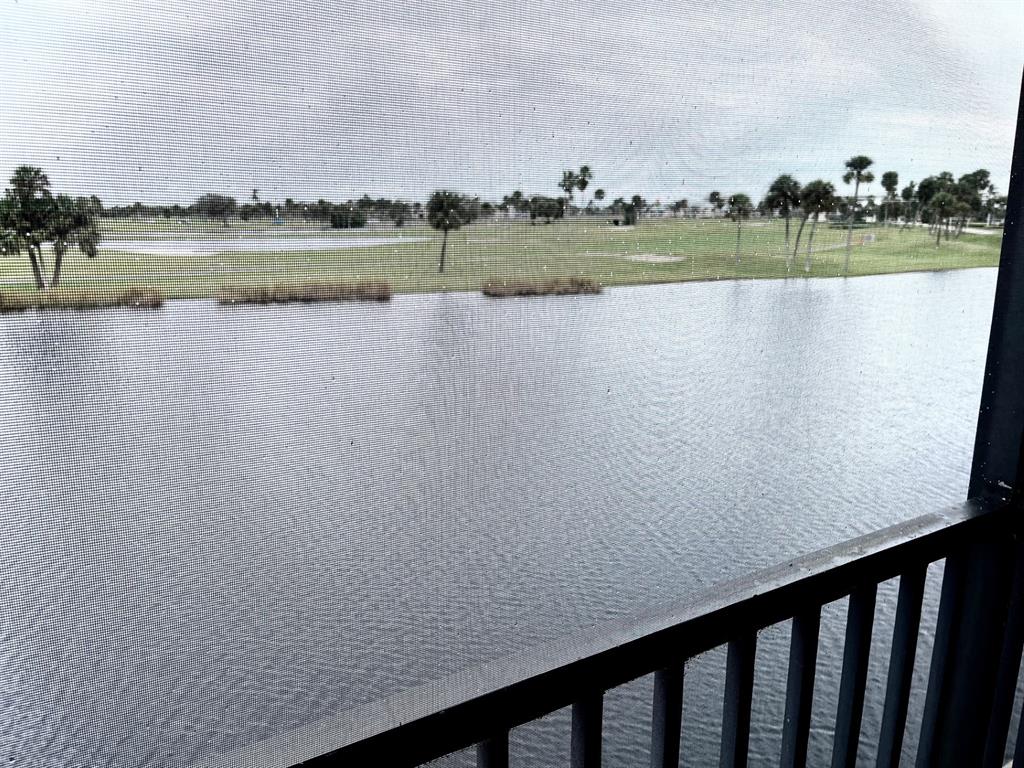 40 Northeast Plantation Road, Unit 208 Stuart, FL 34996 - Photo 27 of 38 a view of lake with green space