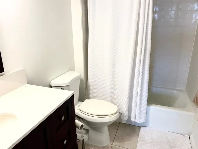 a picture of a bathroom with a sink and a mirror