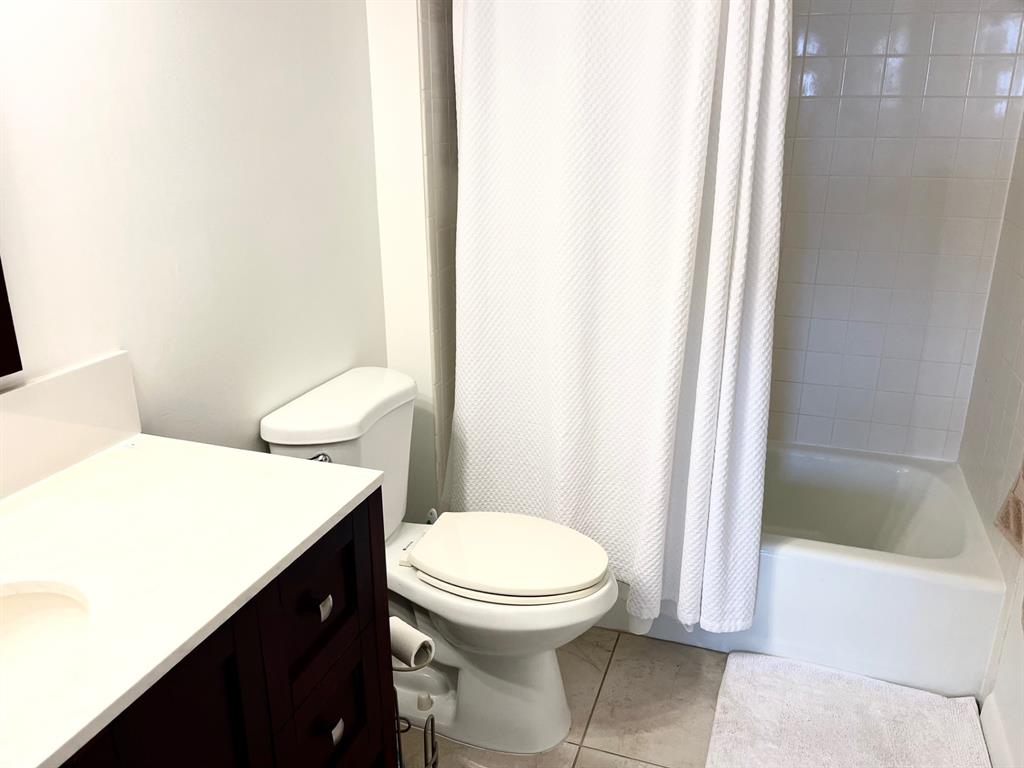 40 Northeast Plantation Road, Unit 208 Stuart, FL 34996 - Photo 28 of 38 a bathroom with a sink a toilet and shower