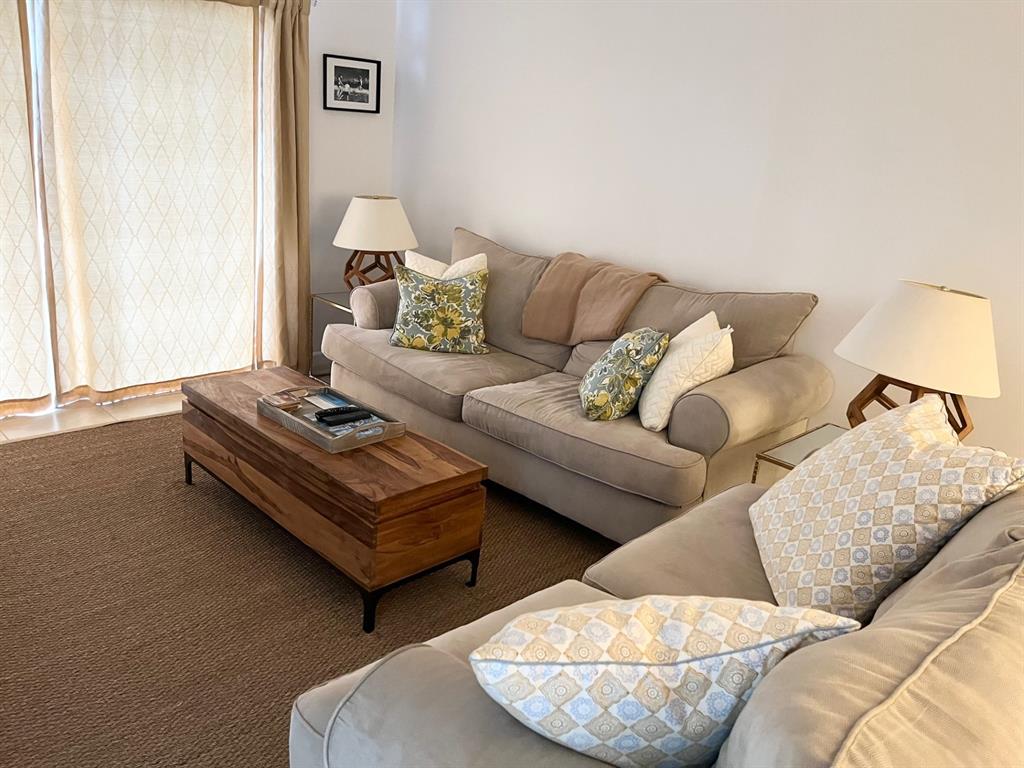 40 Northeast Plantation Road, Unit 208 Stuart, FL 34996 - Photo 31 of 38 a living room with furniture and a window