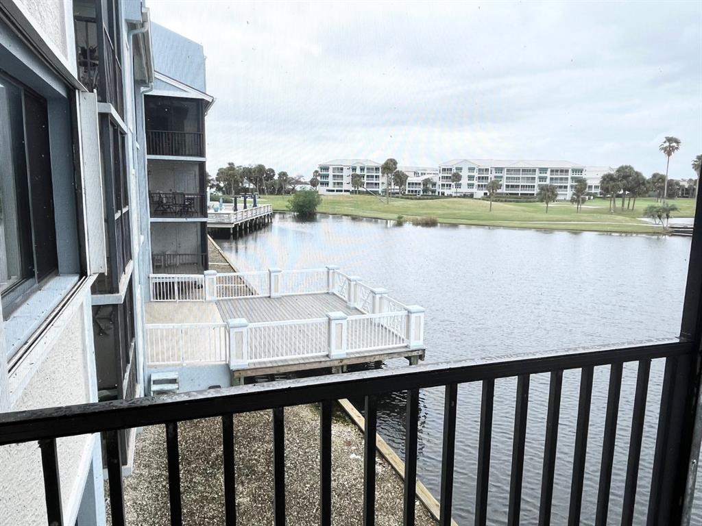 40 Northeast Plantation Road, Unit 208 Stuart, FL 34996 - Photo 32 of 38 a view of a lake from a balcony