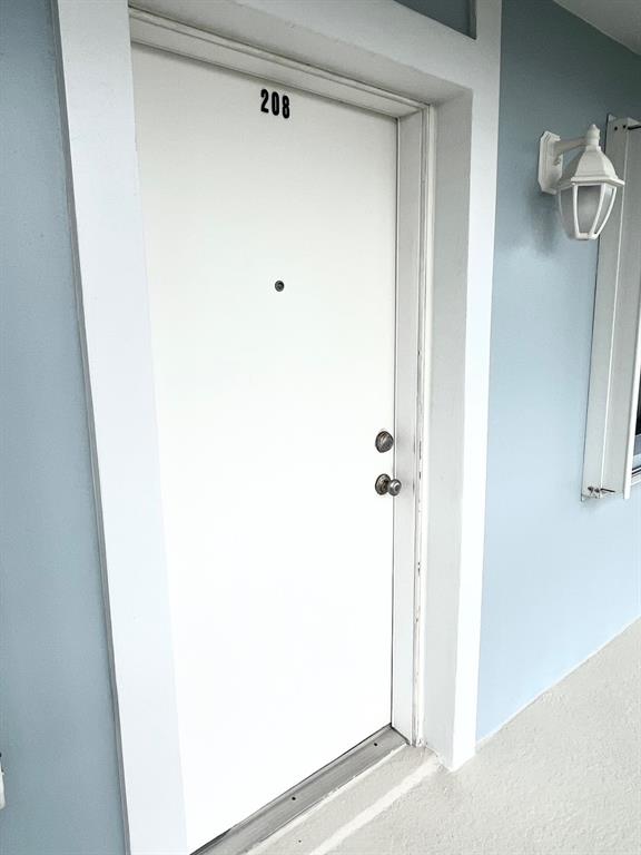 40 Northeast Plantation Road, Unit 208 Stuart, FL 34996 - Photo 34 of 38 a bathroom with a shower