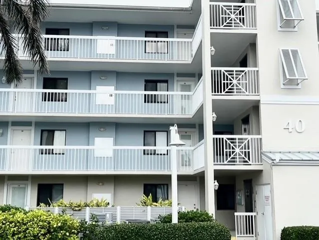 a swimming pool with outdoor seating and garden