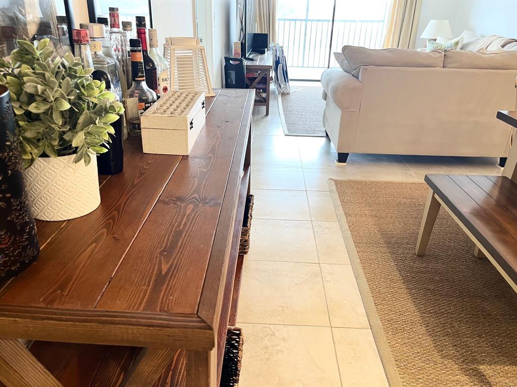 40 Northeast Plantation Road, Unit 208 Stuart, FL 34996 - Photo 5 of 38 a living room with furniture and a potted plant