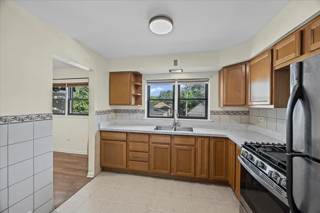 a large kitchen with cabinets and stainless steel appliances
